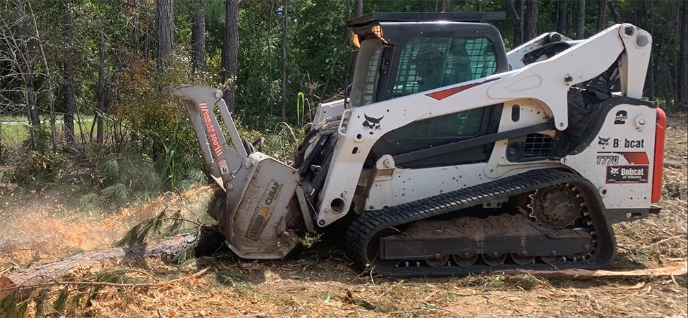 forestry mulching to clear a fallen tree and brush